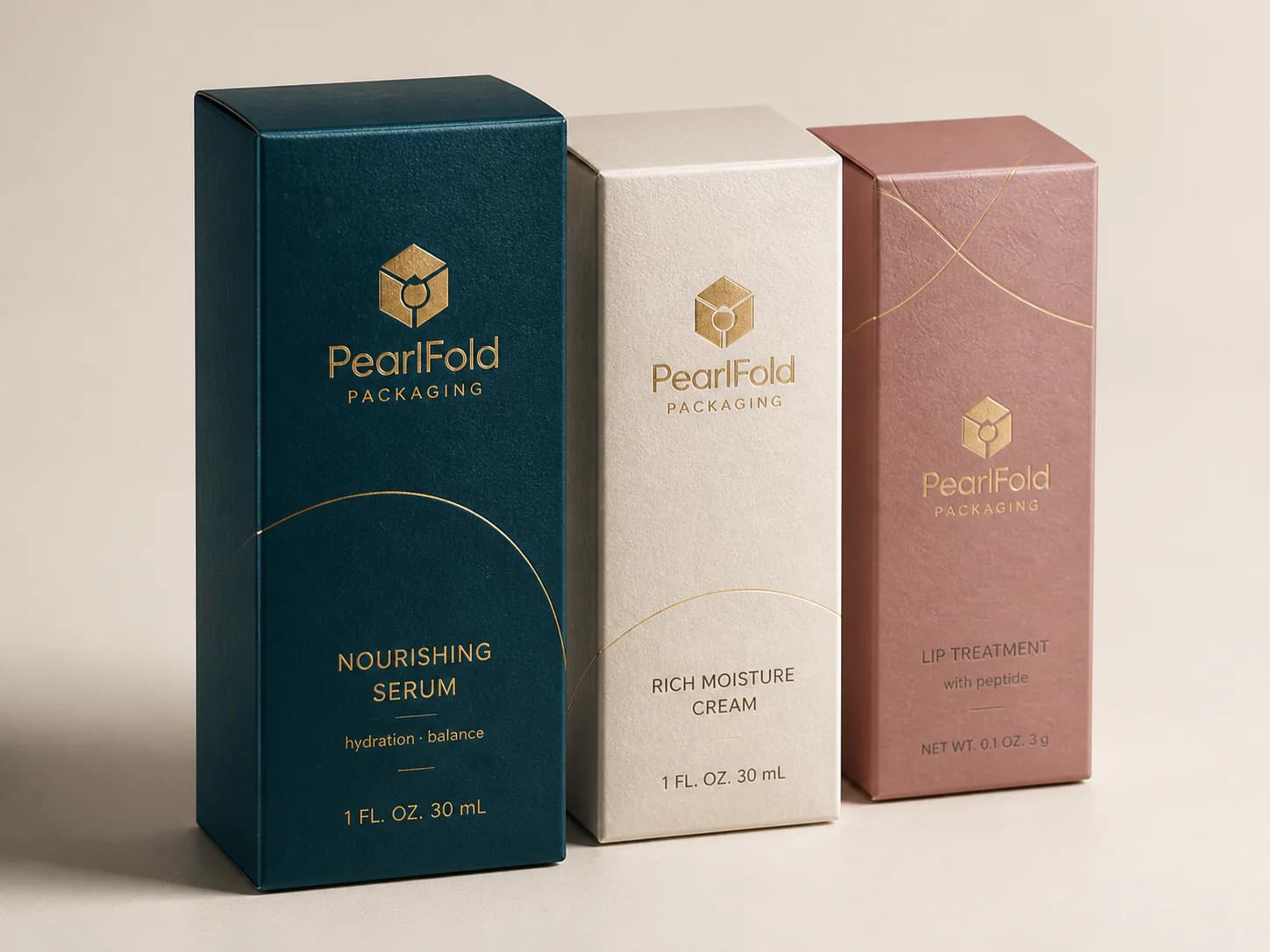 Three PearlFold cartons demonstrating gold foil, tactile pearl paper and embossed surface detail